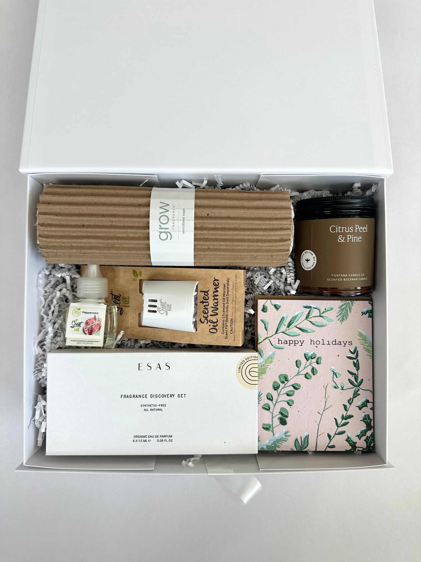 Non-Toxic Fragrance Lover Gift box containing various items including candles, diffusers, and packaging on a white background