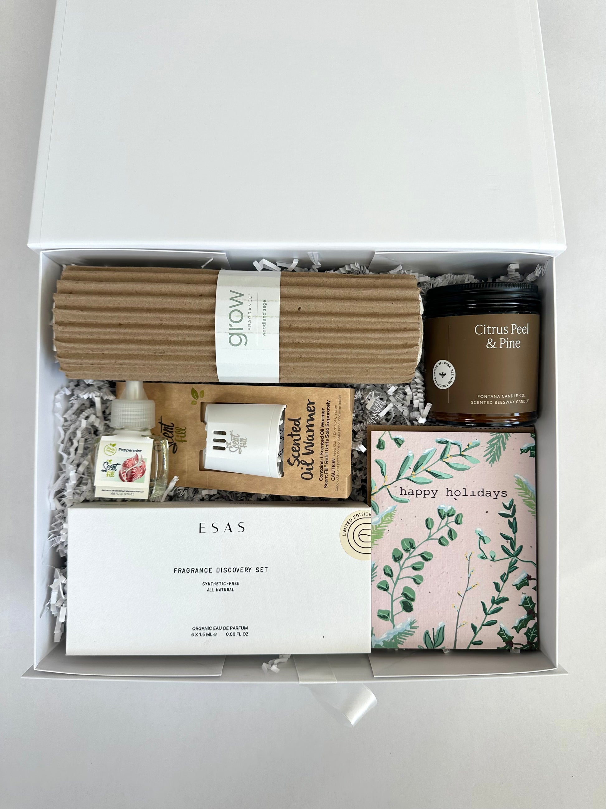 Non-Toxic Fragrance Lover Gift box containing various items including candles, diffusers, and packaging on a white background