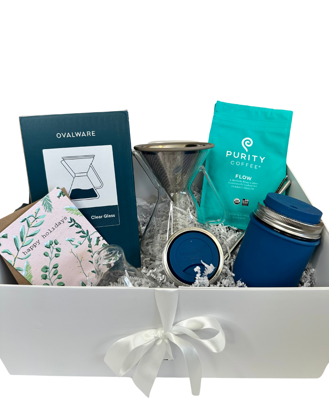 Gift box with coffee-making items including a blue coffee travel mug, pour over, and bag of coffee on a white background.