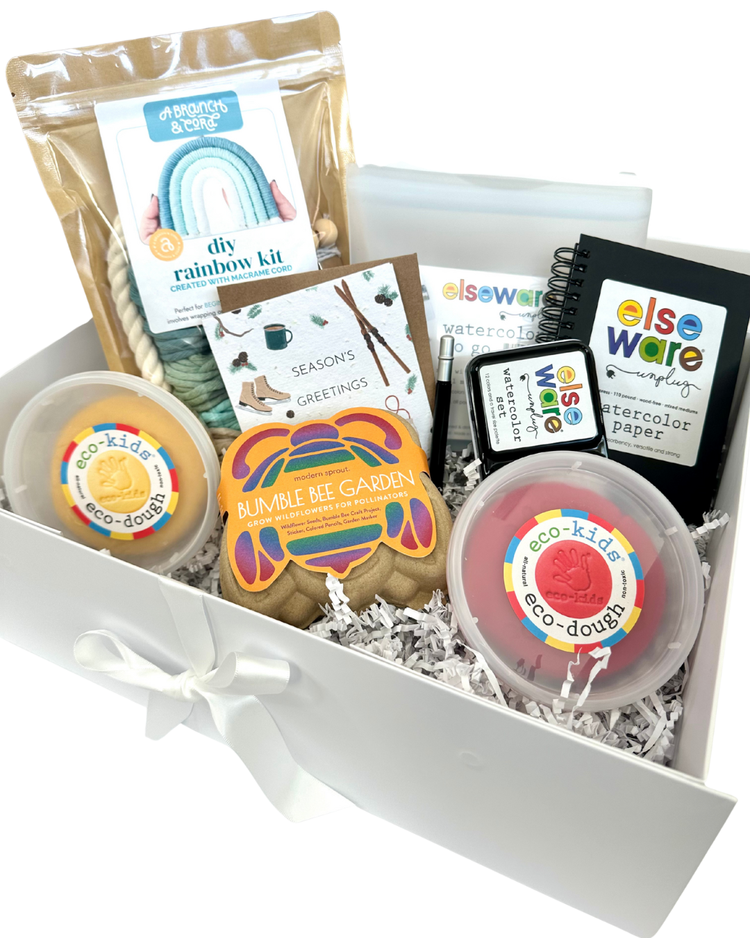 curated gift box for kids that includes assorted art and craft supplies in a box with visible branding on a white background